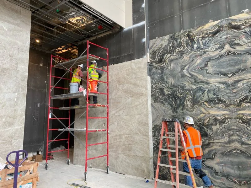 Stone-Tec crew installing natural stone on an active job site
