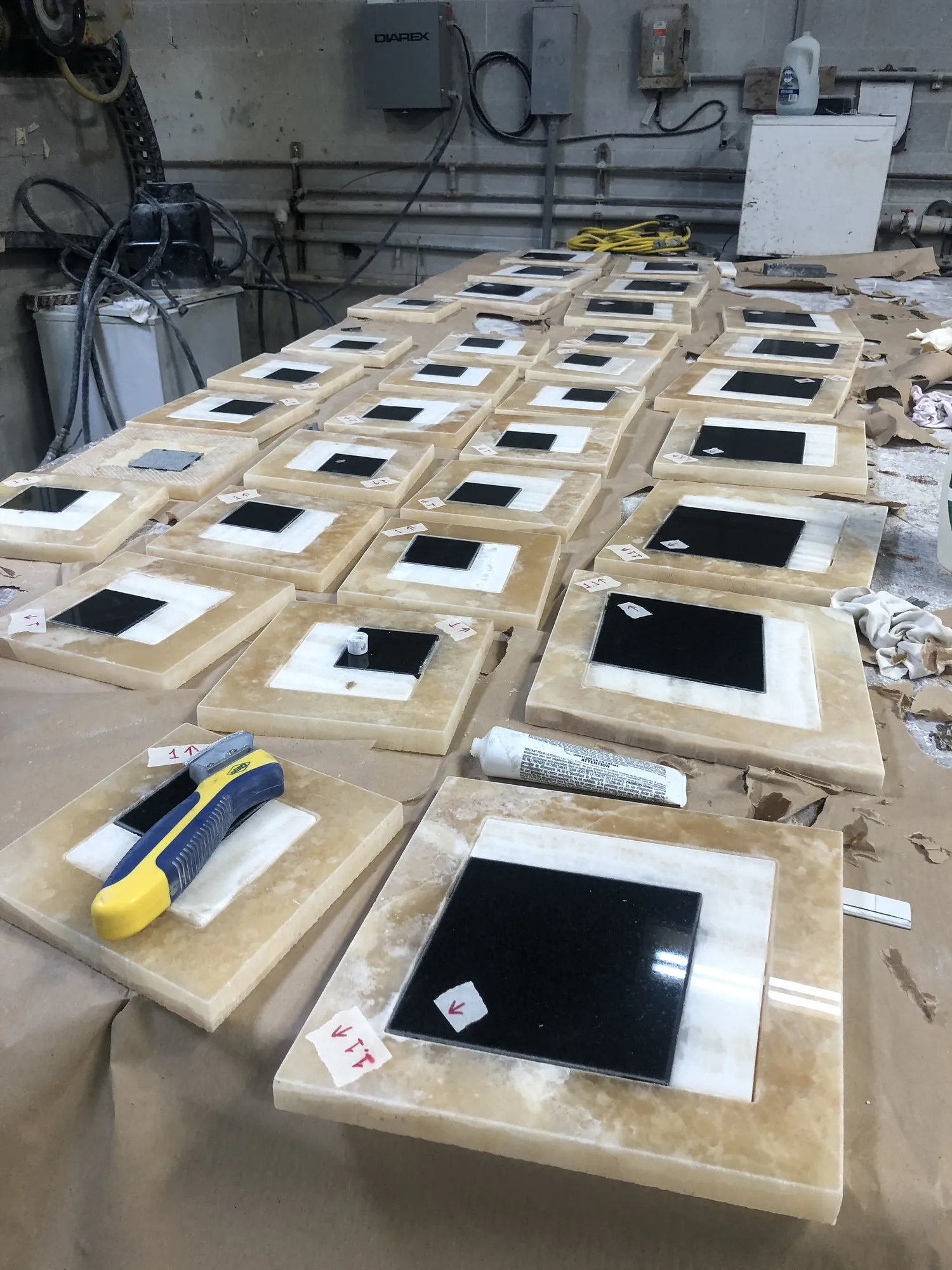 Waterjet-cut onyx inlay pieces laid out in the Stone-Tec shop