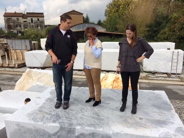 Team inspecting stone blocks at the quarry