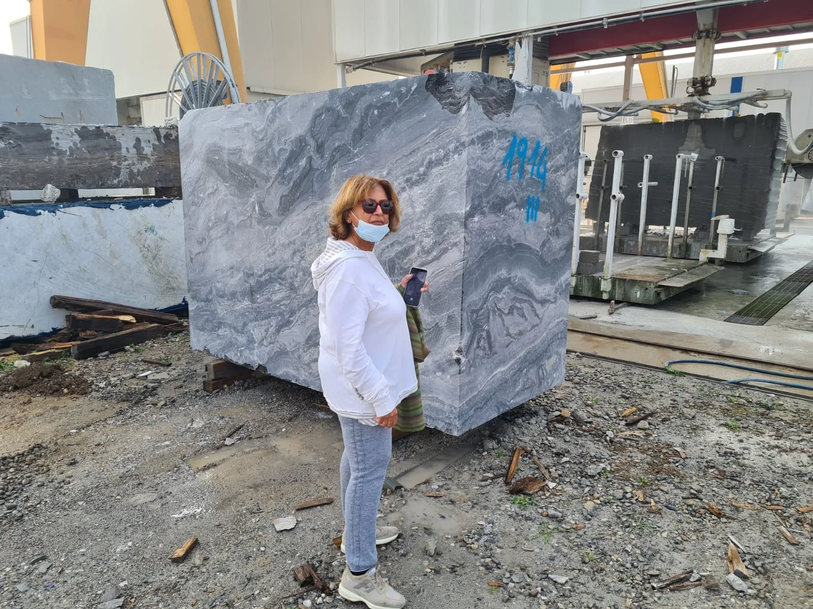 Rupy Shah on-site, inspecting stone blocks before they're cut